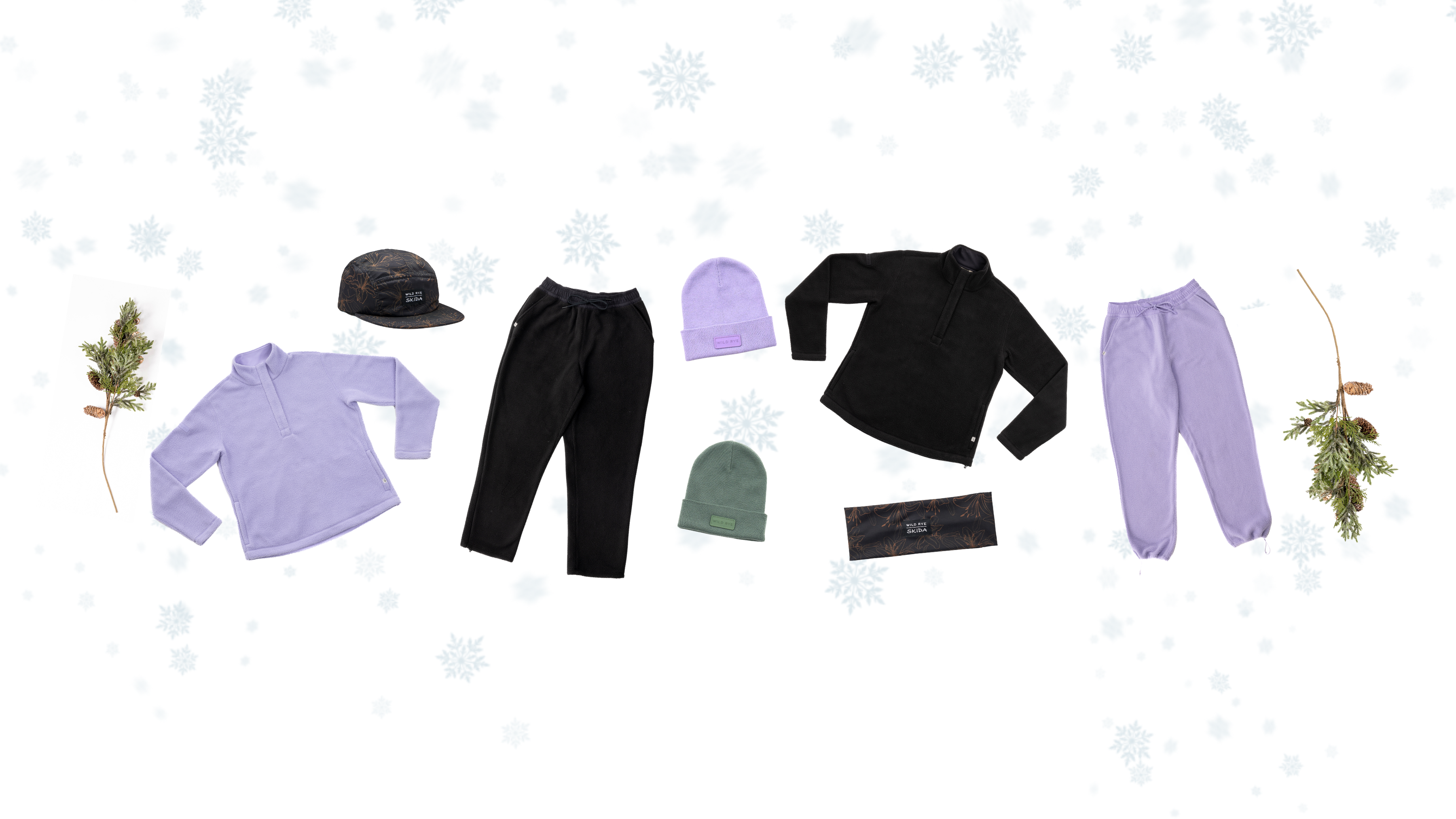 Winter apparel including purple and black tops, pants, and hats on a snowy background.