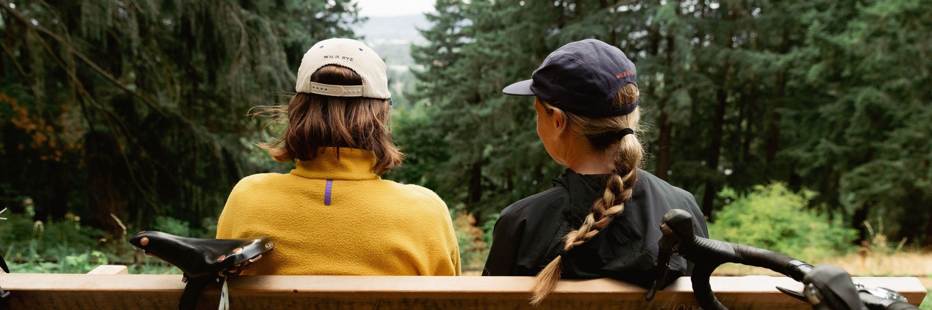 Person wearing an orange cap embroidered with 'Wild Rye'