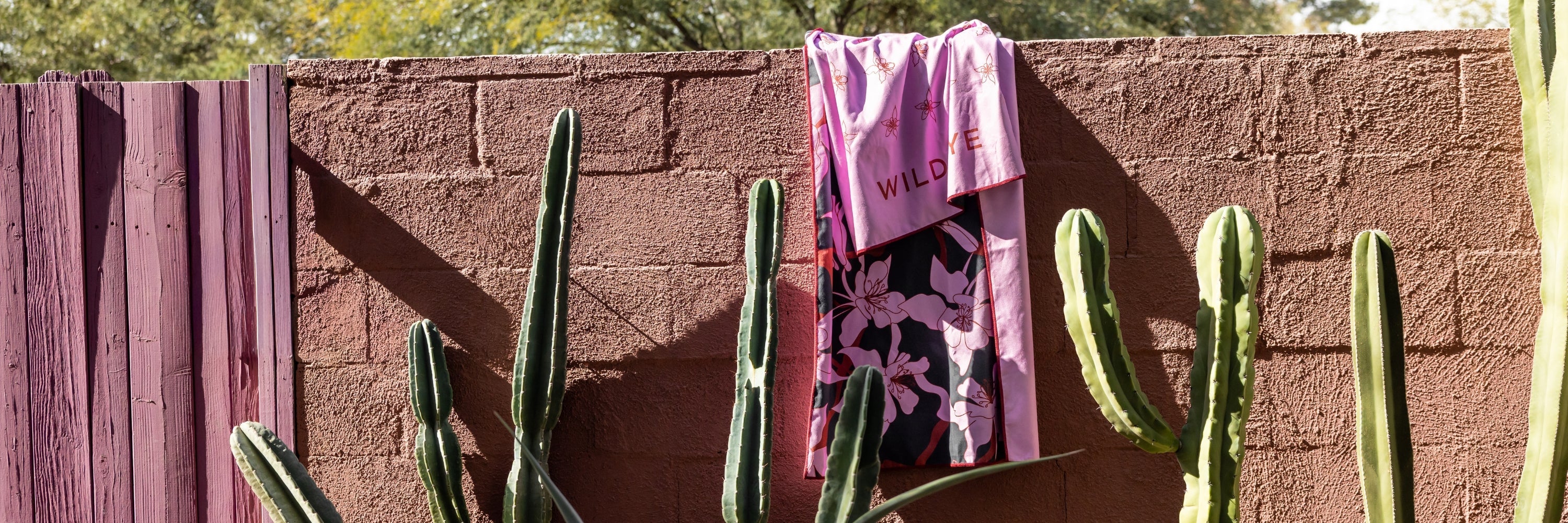 Person wearing an orange cap embroidered with 'Wild Rye'