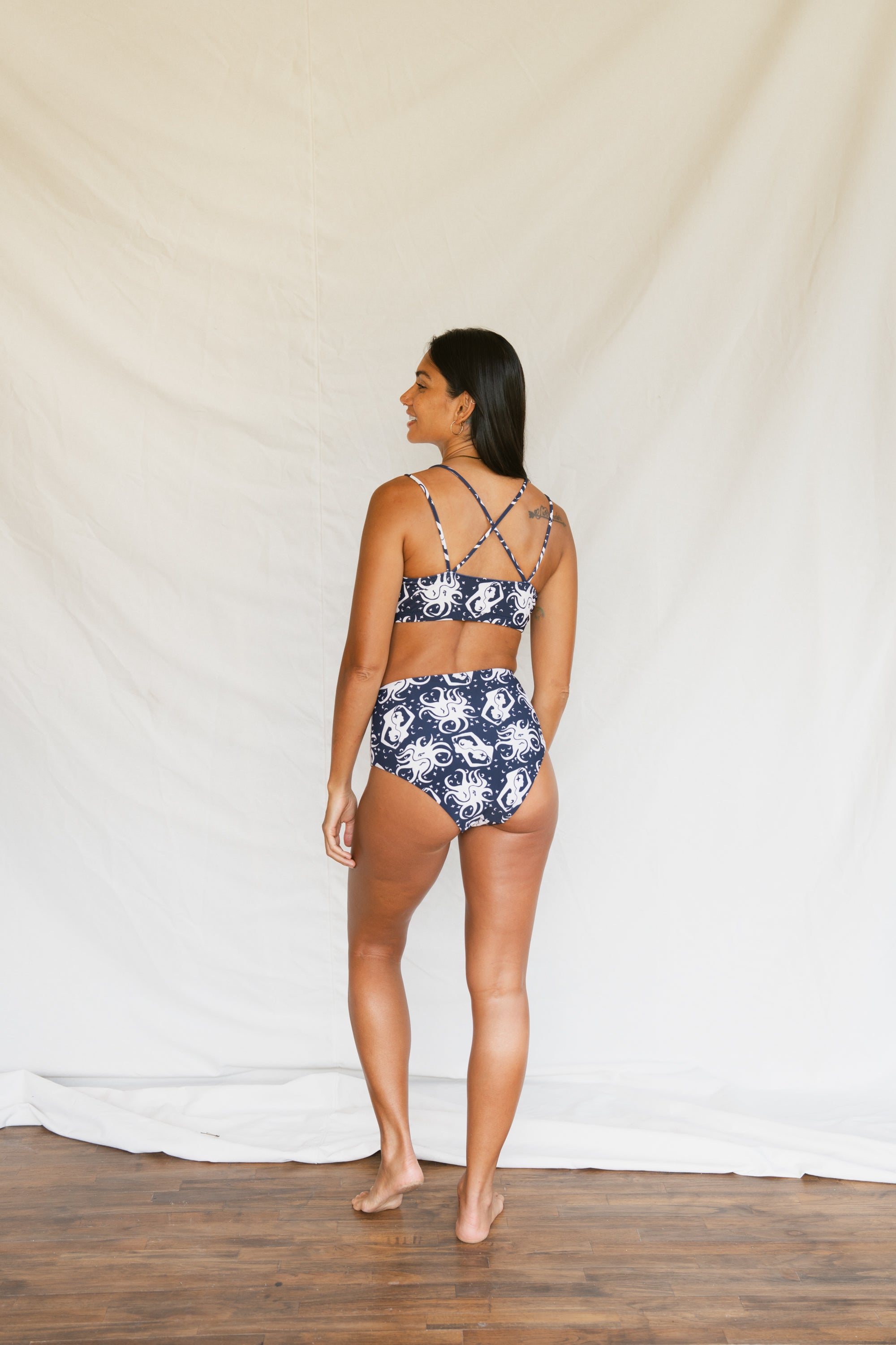 Woman wearing September Topanga Top, and lucky bottom, back full body view