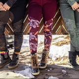 Women wearing leggings with snow boots