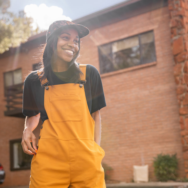 [Ochre] Woman Smiling Wearing Overalls