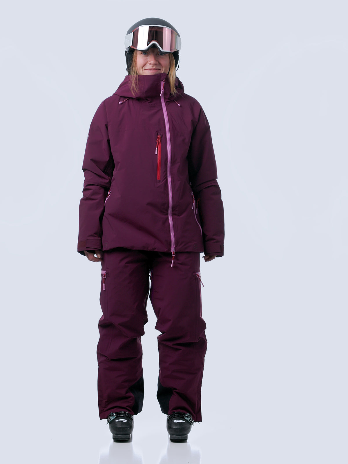 Woman wearing mulberry roundhouse 2l ski kit, walking into frame, turning and walking out