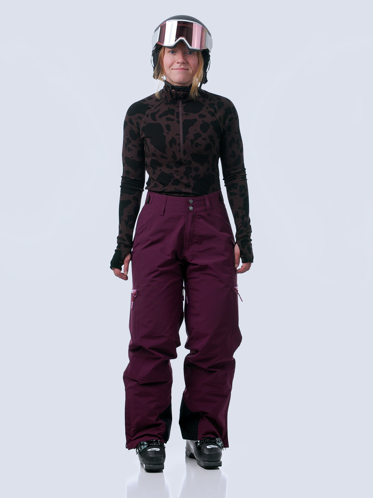 Woman walking in and out of the frame of a video wearing the roundhouse 2l pant in mulberry