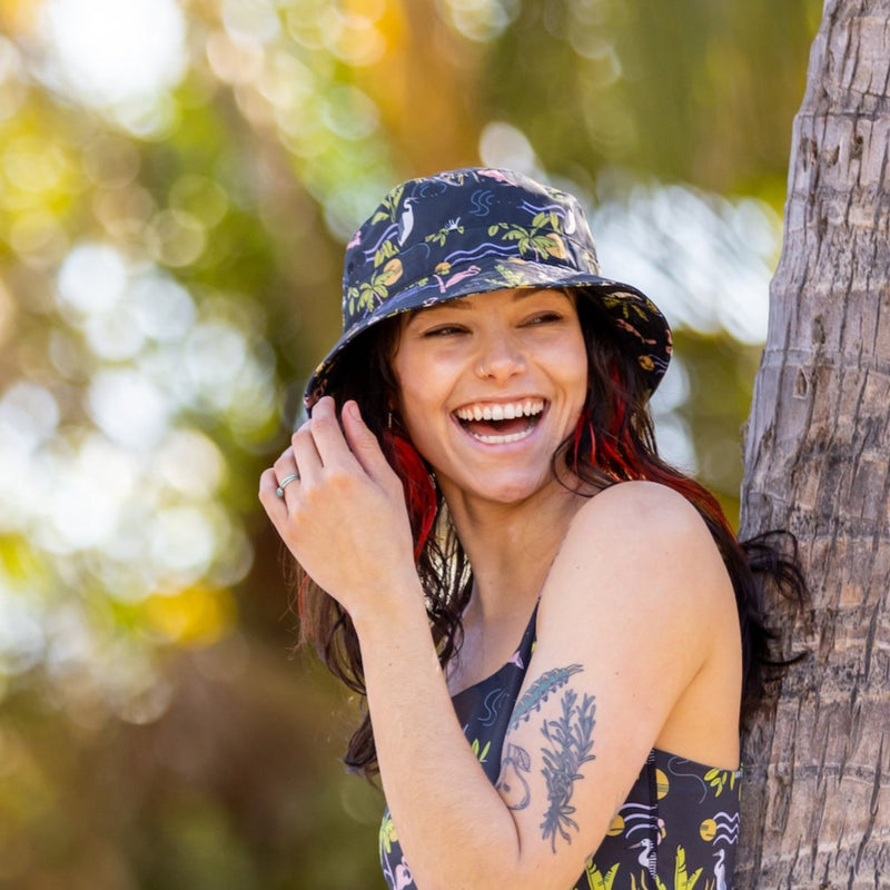 Woman smiling wearing bucket hat