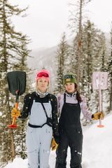 Women with snow shovels