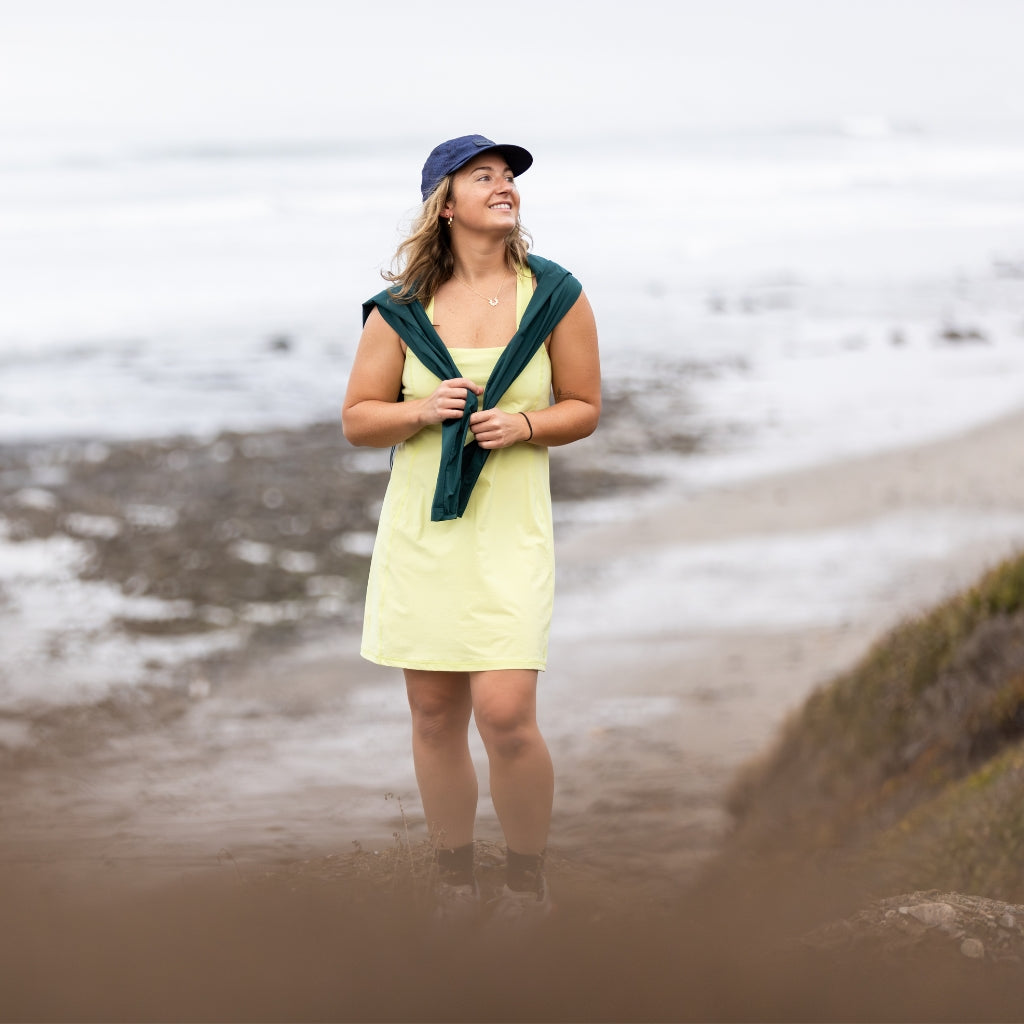 [Iced Matcha] Woman standing on cliff overlooking beach