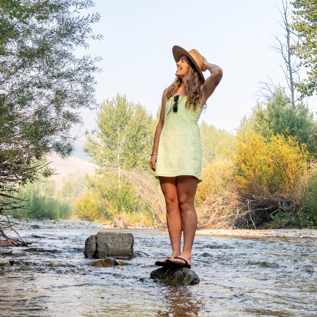 [Iced Matcha] Woman standing on river rock wearing parker action dress in iced matcha