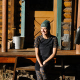 Woman Wearing Nona Lite Short Sleeve Top Desert Dream At Cabin