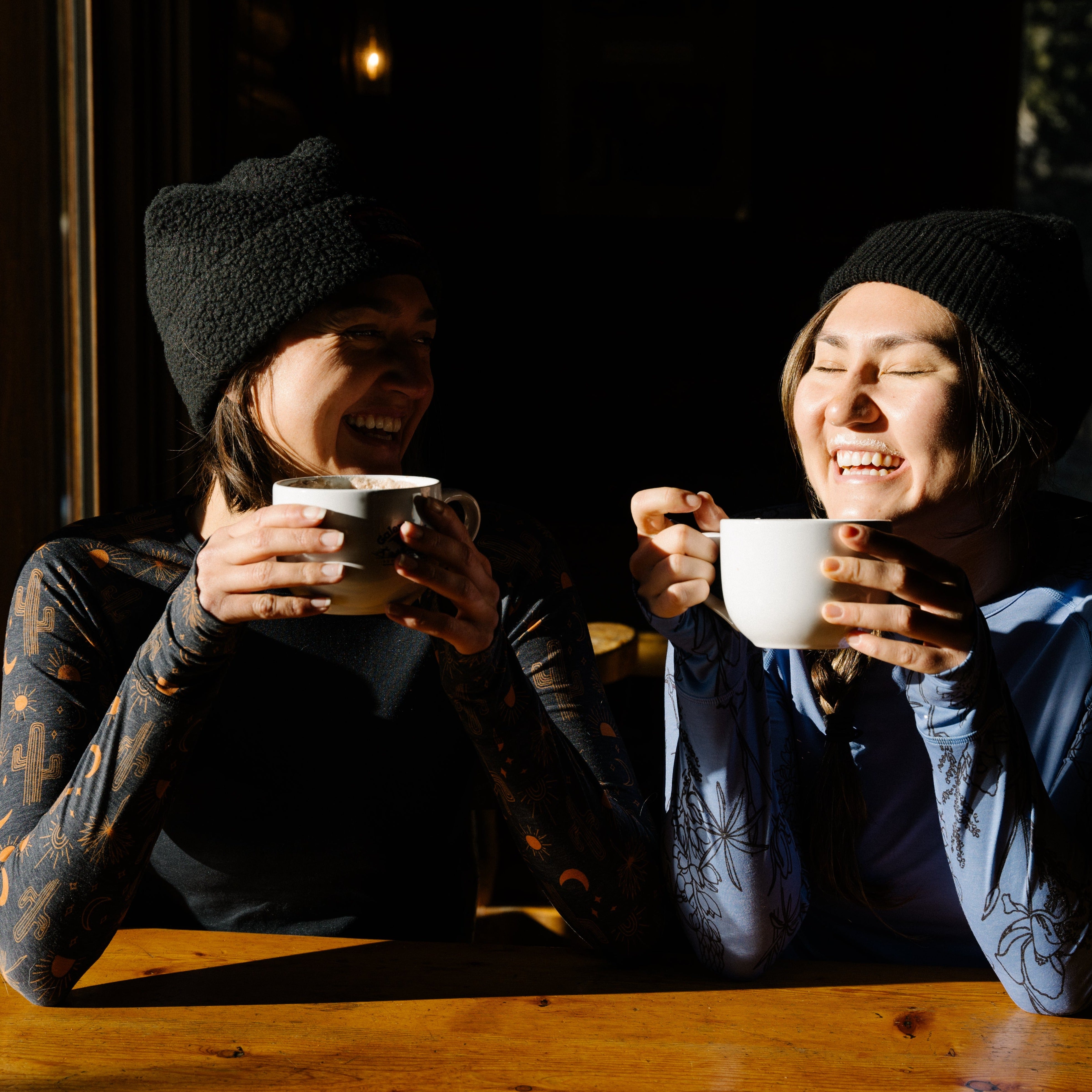 [Alpine Bloom] Women Drinking Coffee Wearing Evie Raglan Baselayers