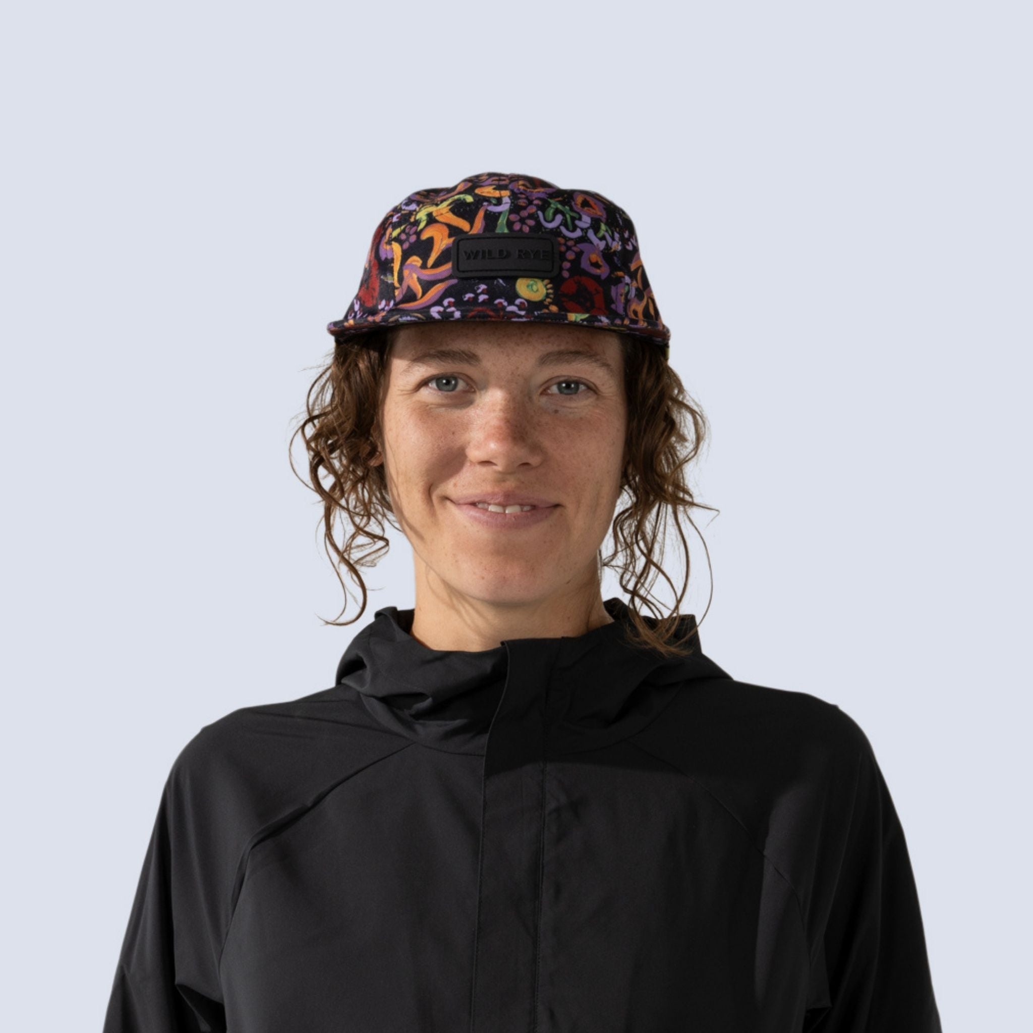 [Understory] Woman wearing black baseball hat with colorful deep sea inspired print