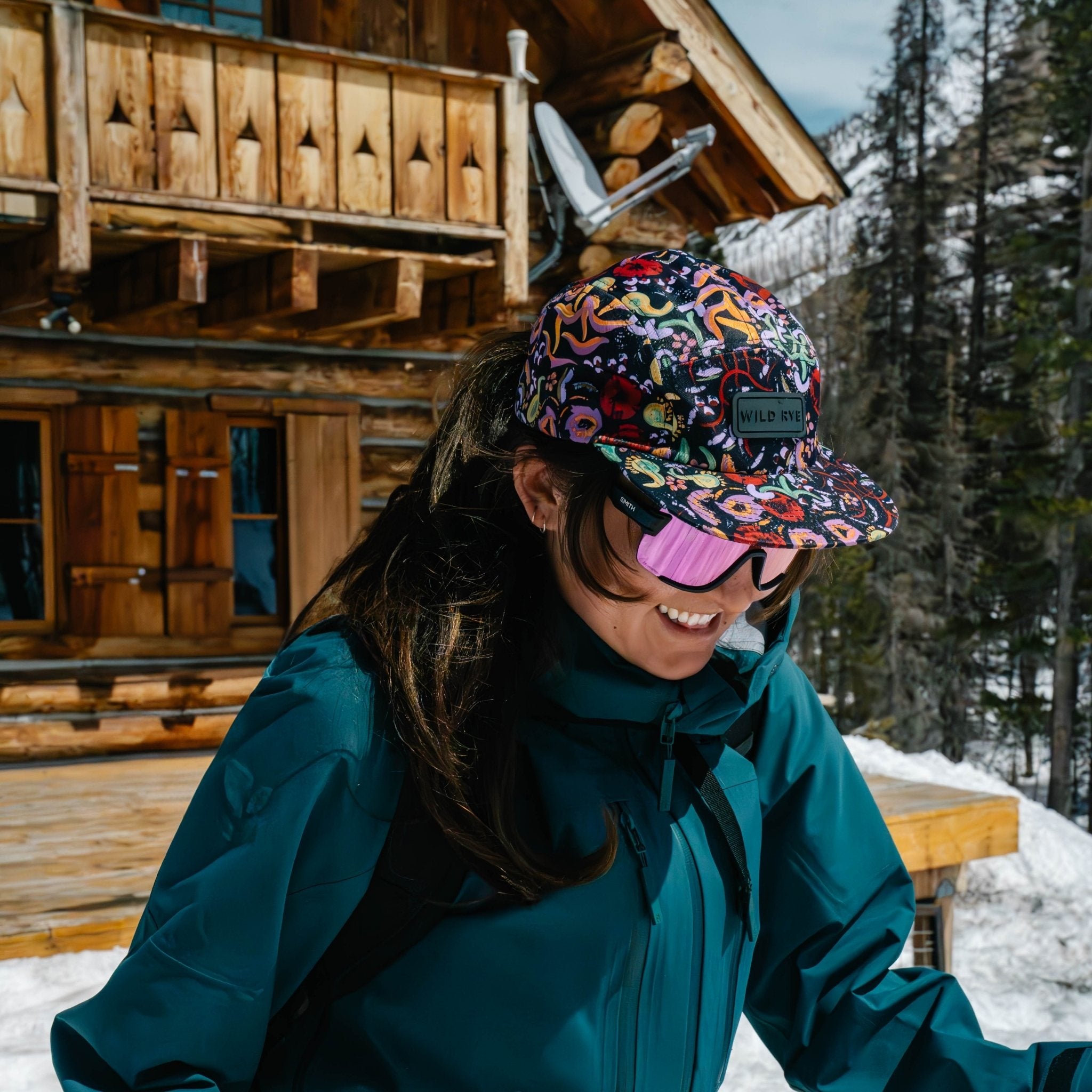 [Understory] Woman heading out on a ski tour from a backcountry ski hut