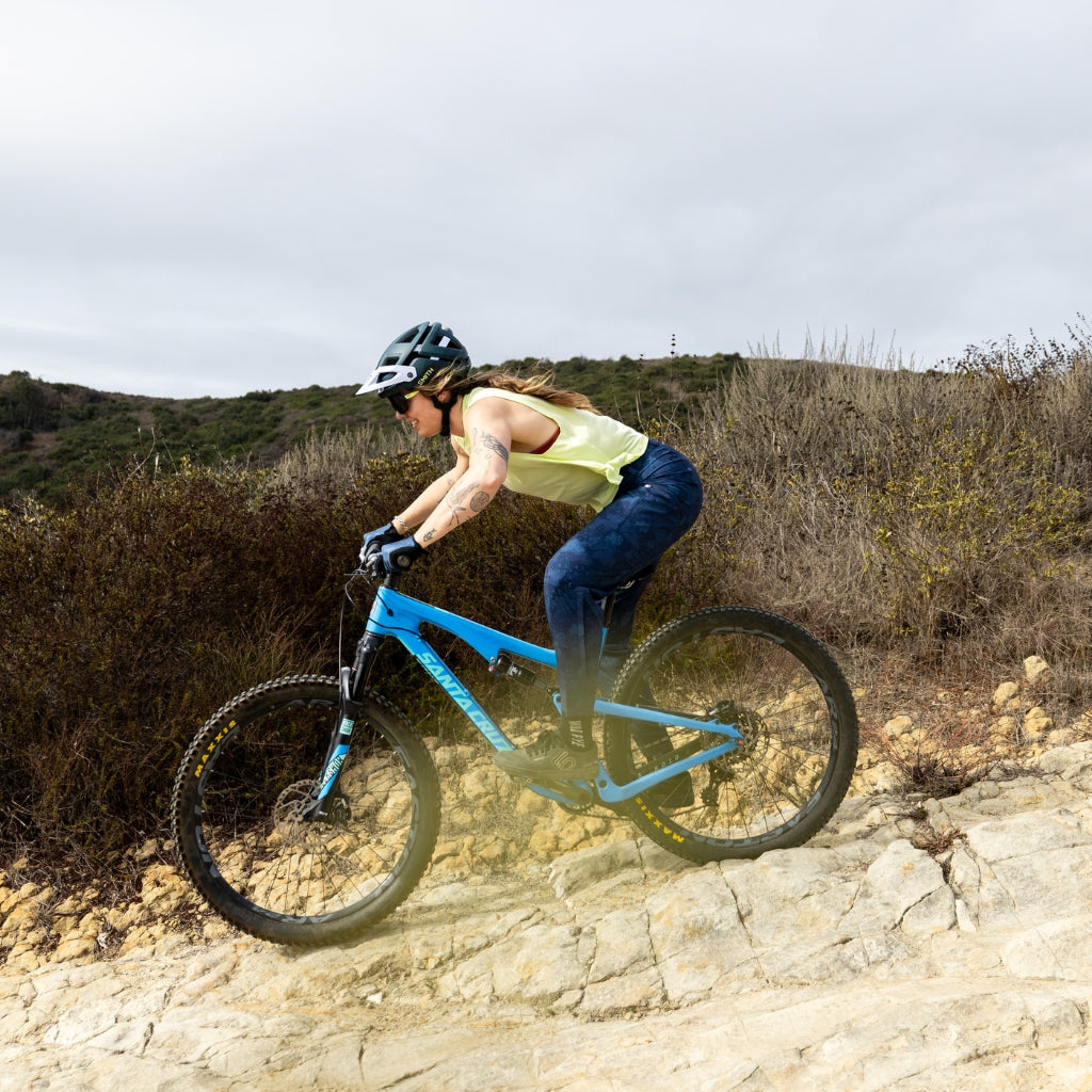 [Cloud Camo] Woman riding downhill on mountain bike