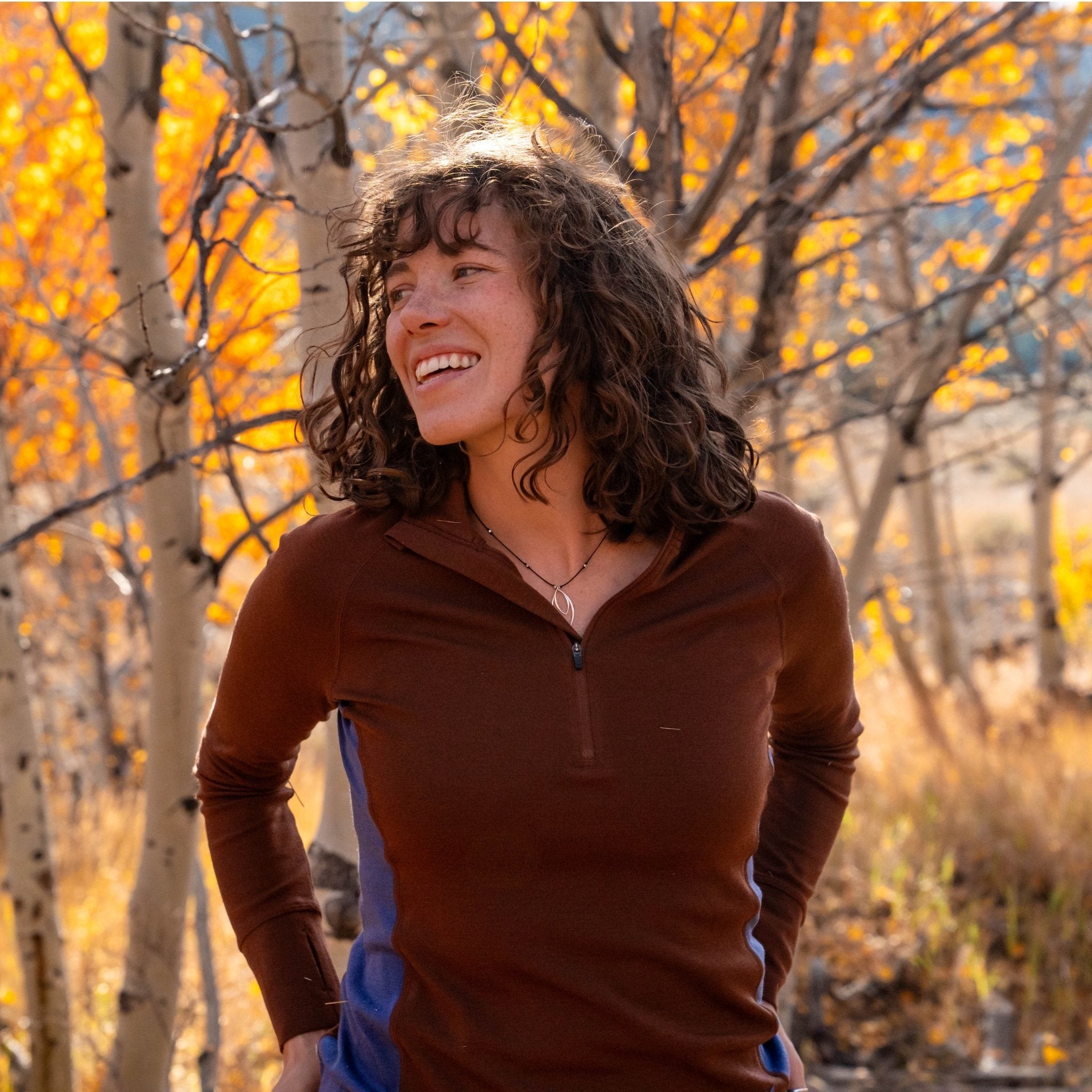 [Chestnut Storm] Woman standing in a forest with autumn foliage