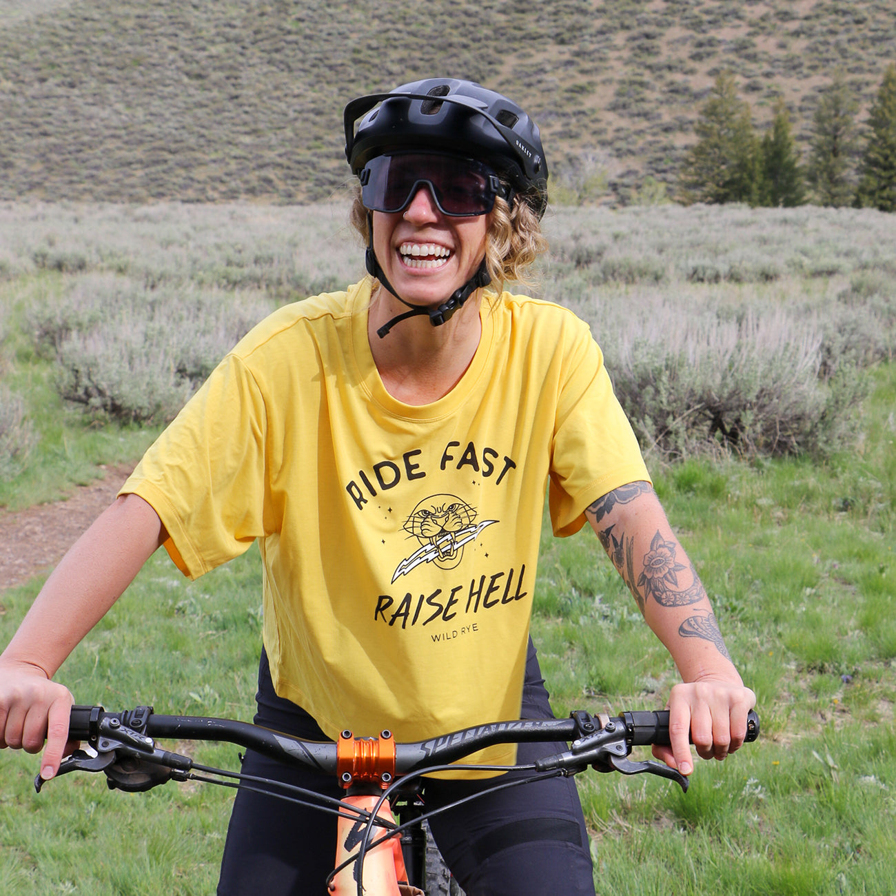 [RFRH Sunshine] Woman smiling on mountain bike