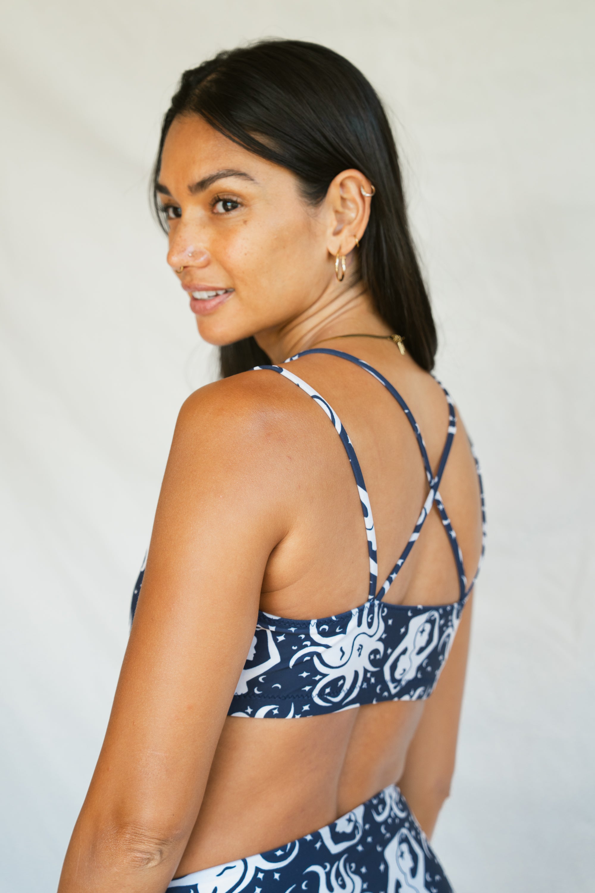 Woman wearing September Topanga Top, back crop view with criss cross straps