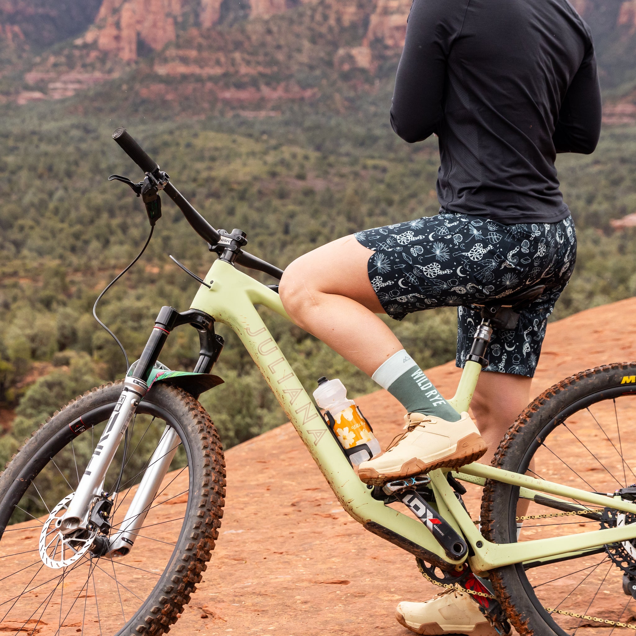 [Witchy Woman] Woman Wearing Riley Shorts on Green Bike