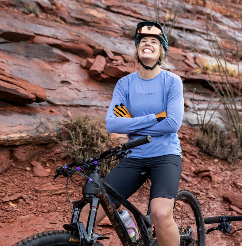 Woman Smiling On Mountain Bike