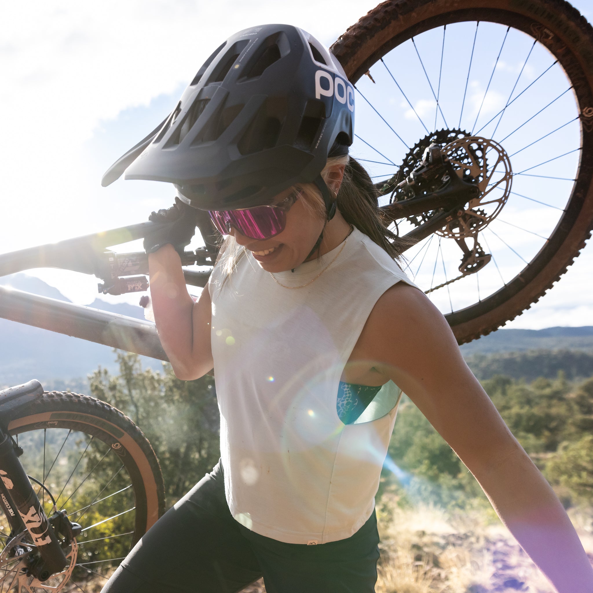 [Mist] Woman Lifting Bike Wearing Keller Crop Tank