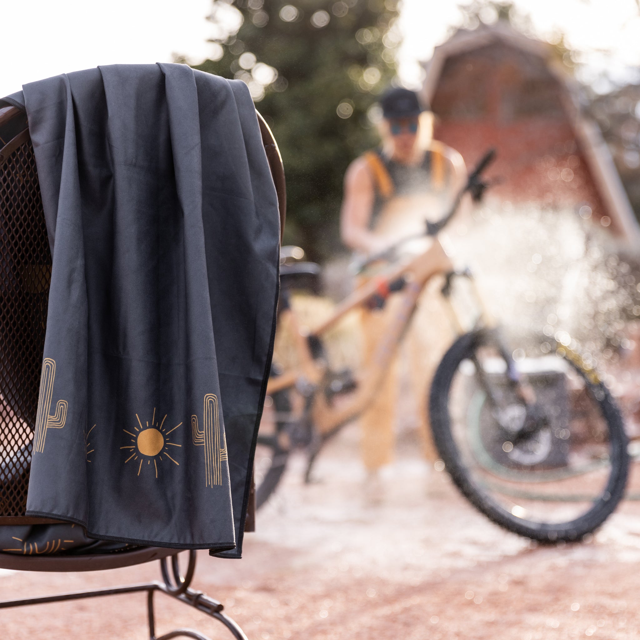 [Desert Dream-Black] Wild Rye Camp Towel Desert Dream-Black Draped Over Chair