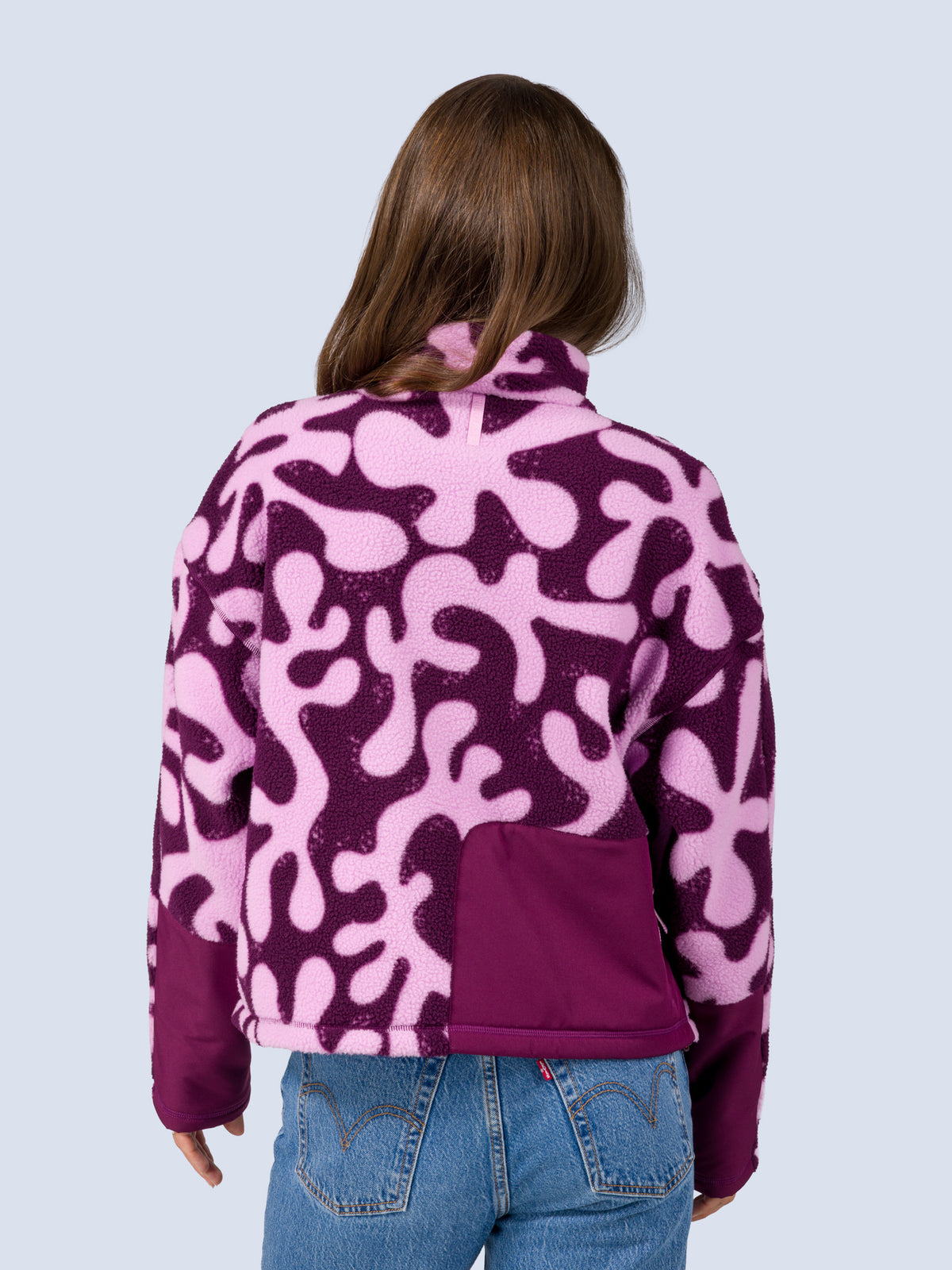 [Mulberry Reef] Close-up back view of the Banner 3/4 Zip Jacket in purple and pink abstract-print fleece, showing the mock neckline and back pocket