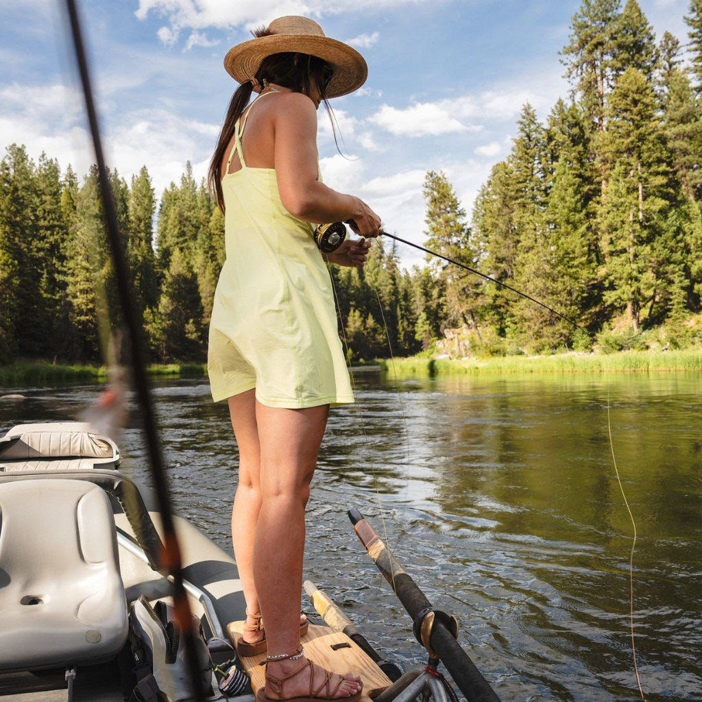 [Iced Matcha] woman fly fishing off of driftboat wearing parker dress in iced matcha