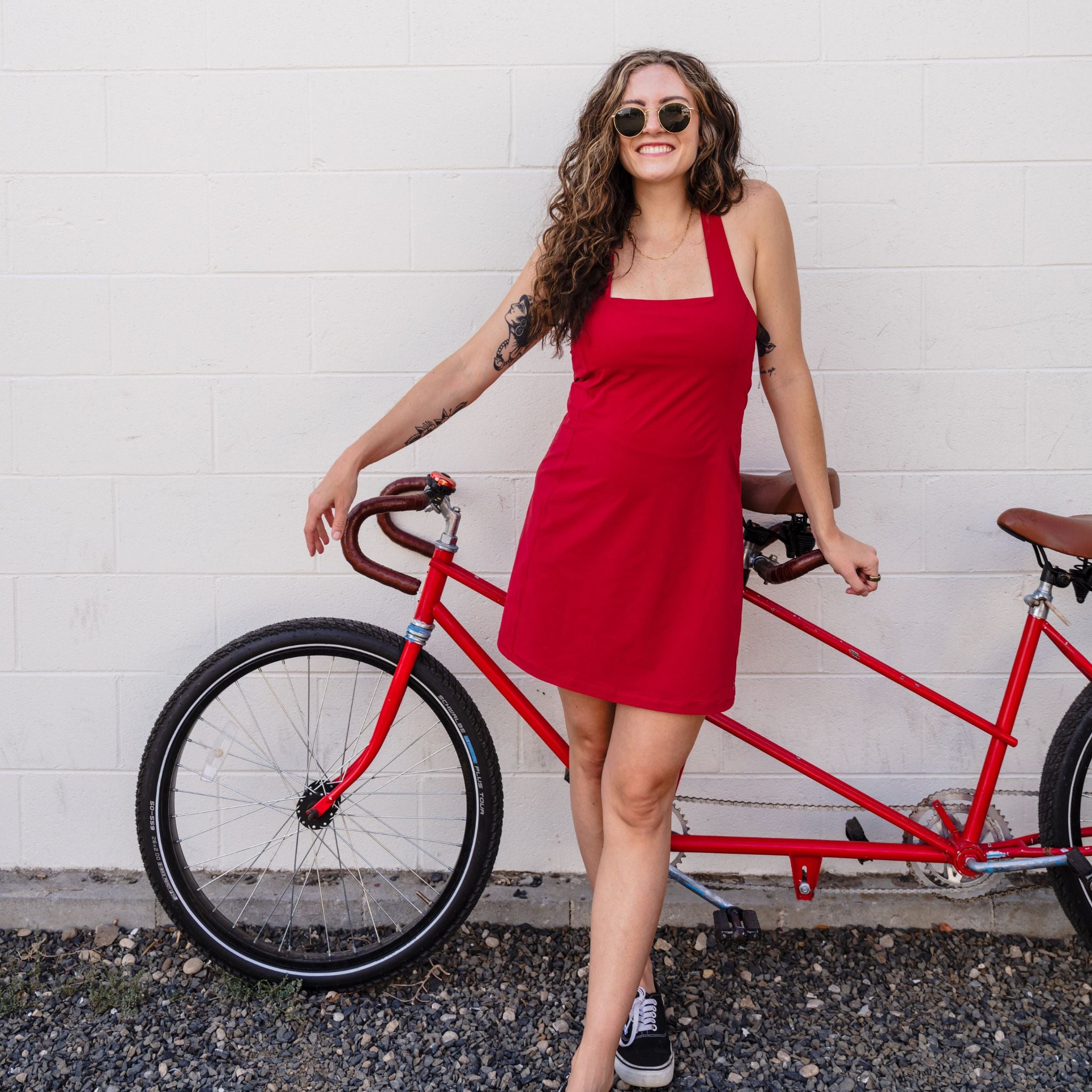 [Star Garnet] woman leaning up against red tandem bicycle