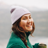 [Lavender Haze] Woman wearing lavender knit beanie and drinking coffee