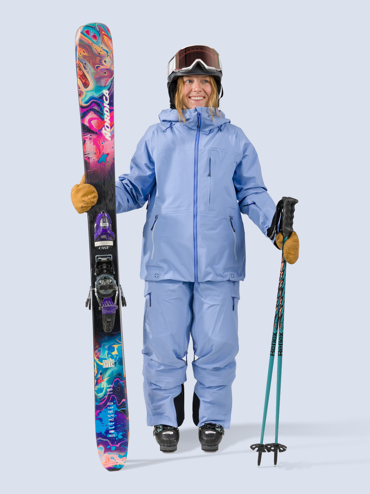 [Breeze] Butterfield 3L Jacket in breeze blue, on model with skis shot