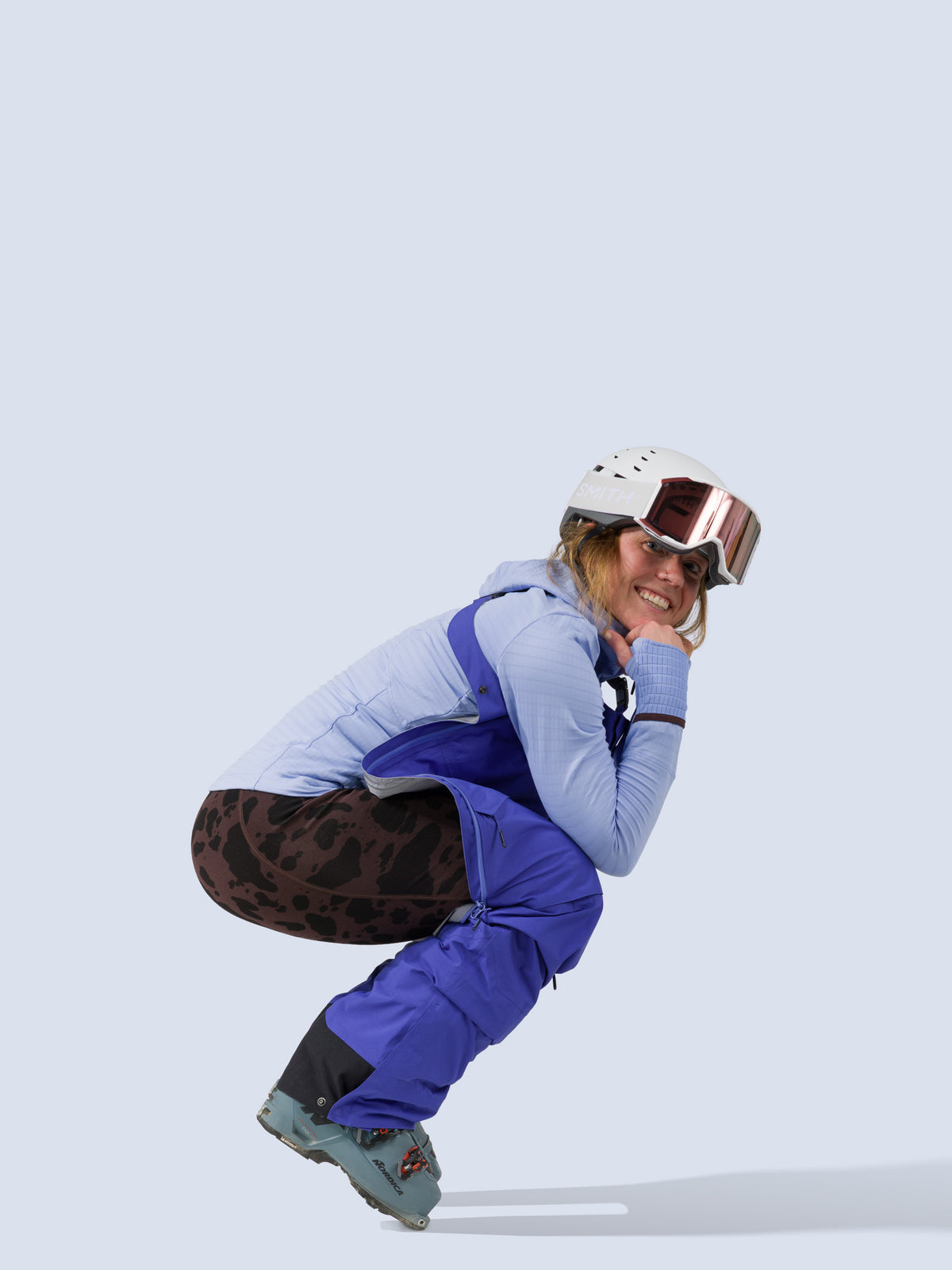 [Lapis] Heyburn 3L Bib in lapis blue, on model squatting shot