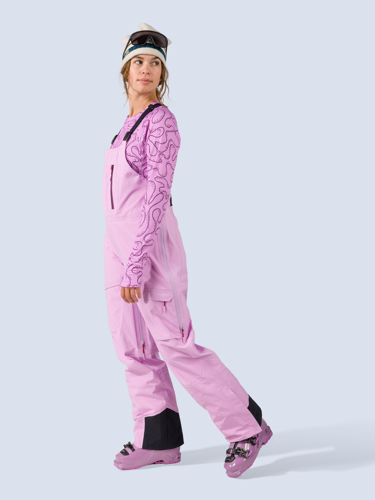 [Orchid] Heyburn 3L Bib in orchid pink, on model side walking shot