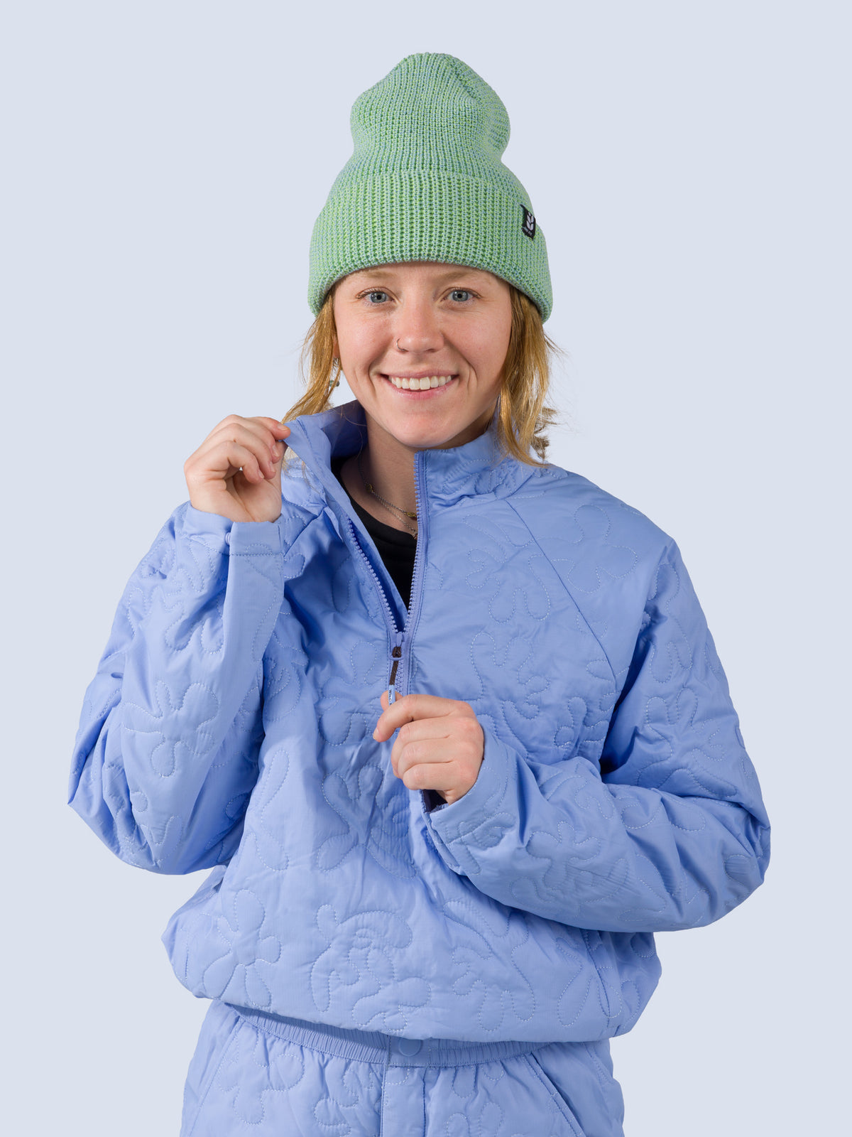 [Breeze Reef] Payette Pullover – close-up of model holding the quarter-zip pull at the collar