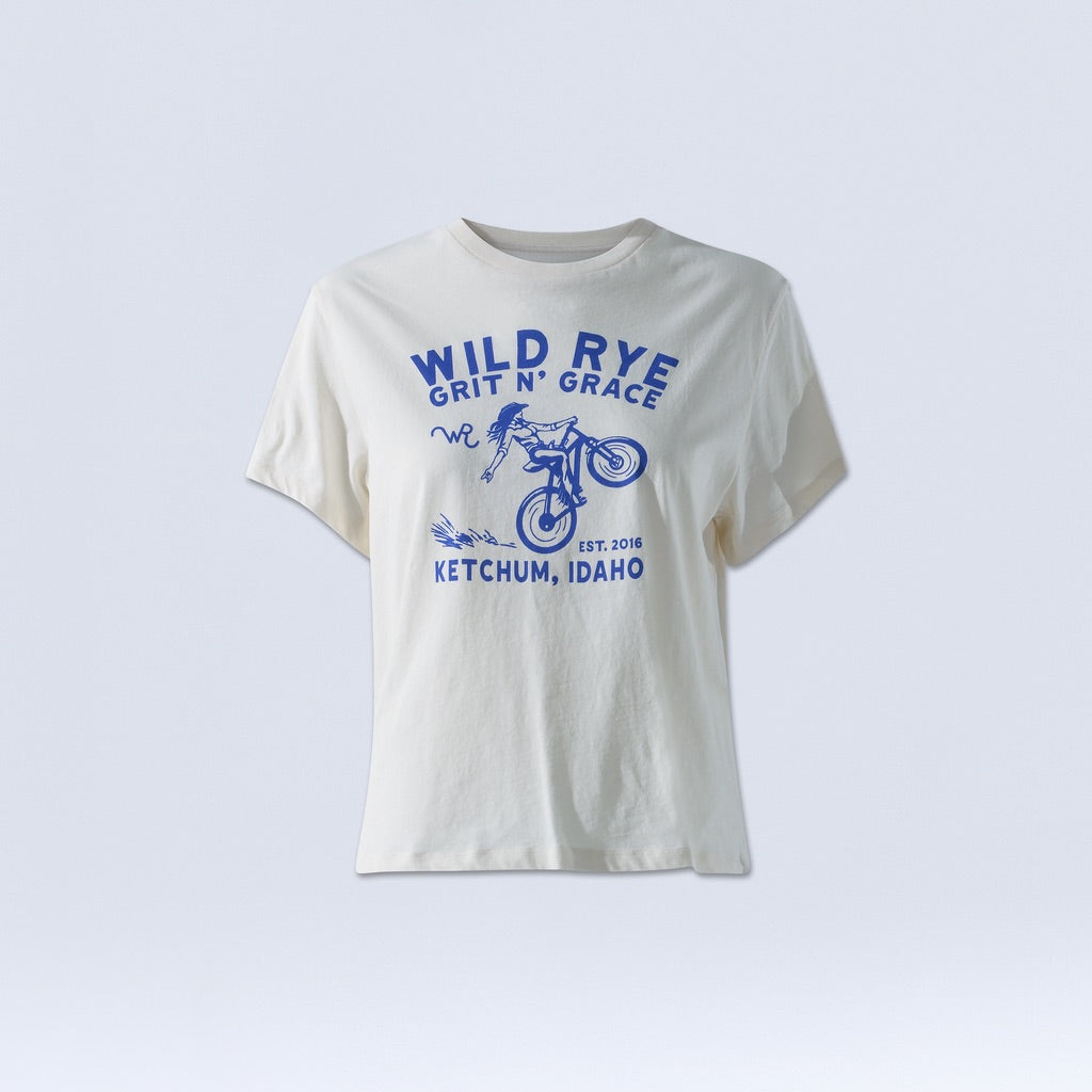 [Bluebell Grit] White graphic tee with blue text reading "wild rye grit n grace, Ketchum, Idaho"