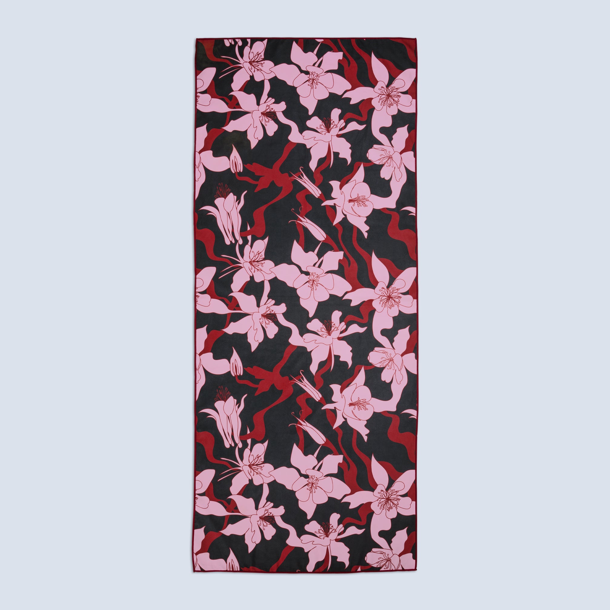 Quick drying towel with pink floral pattern on a black base fabric