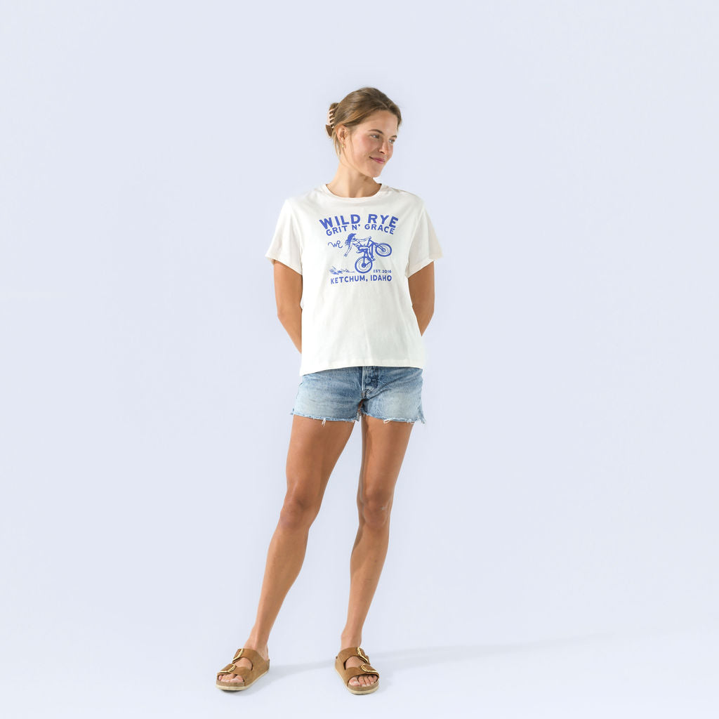 [Bluebell Grit] [Black Grit] Wild Rye Grit n Grace graphic tee in white, worn on model with shorts, full body view