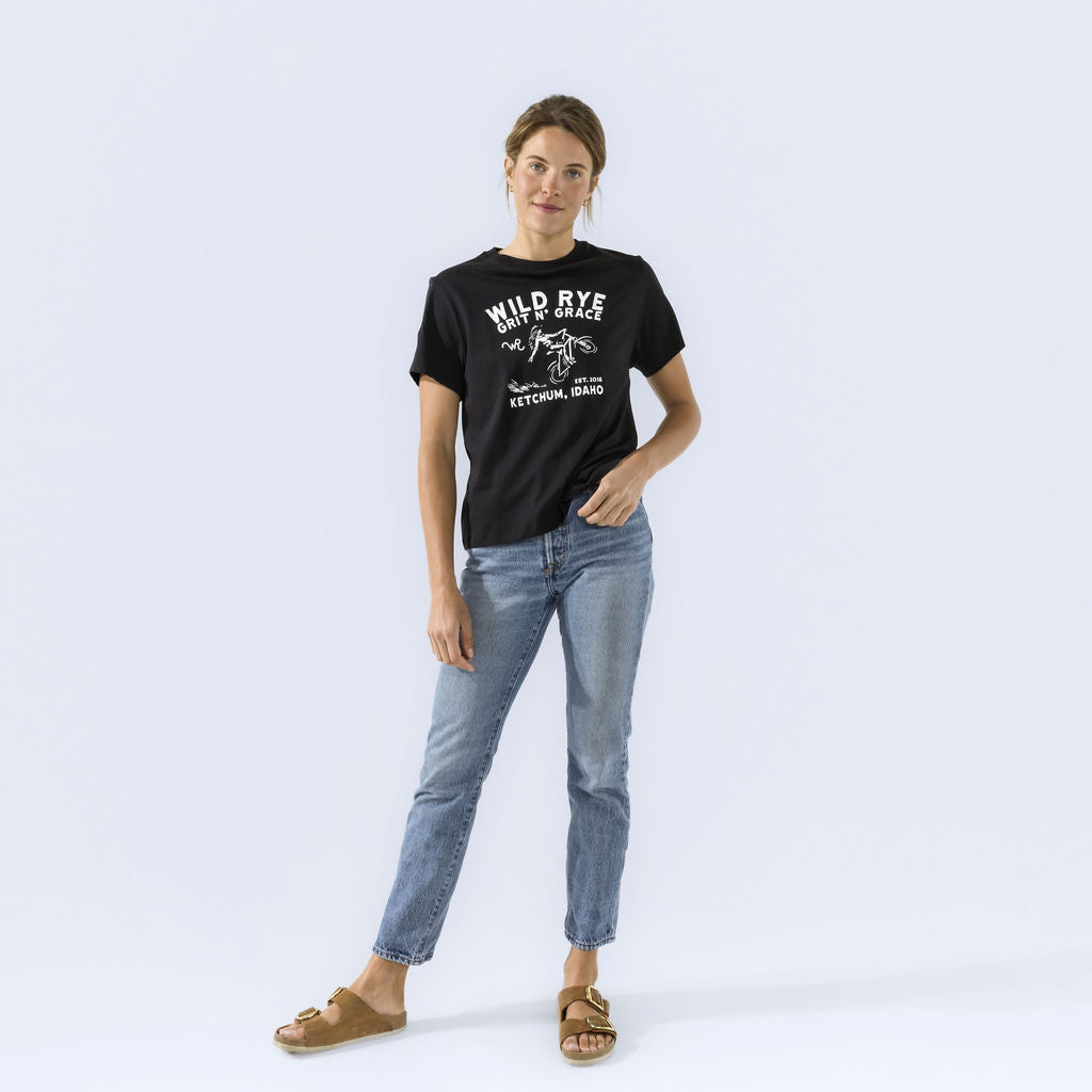 [Black Grit] Wild Rye Grit n Grace graphic tee in black, worn on model with jeans