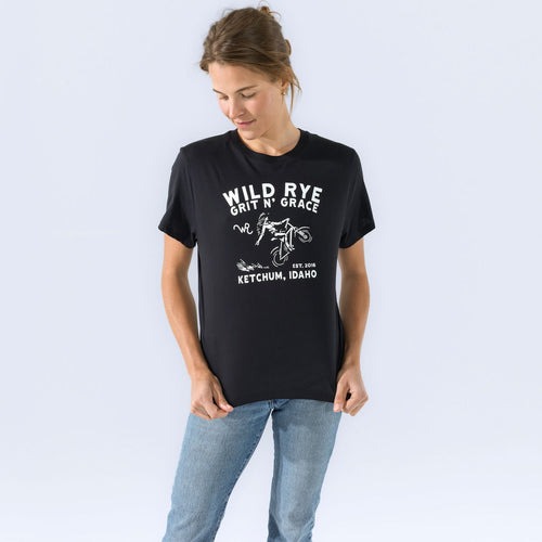 [Black Grit] Wild Rye Grit n Grace graphic tee in black, worn on model with jeans, crop view