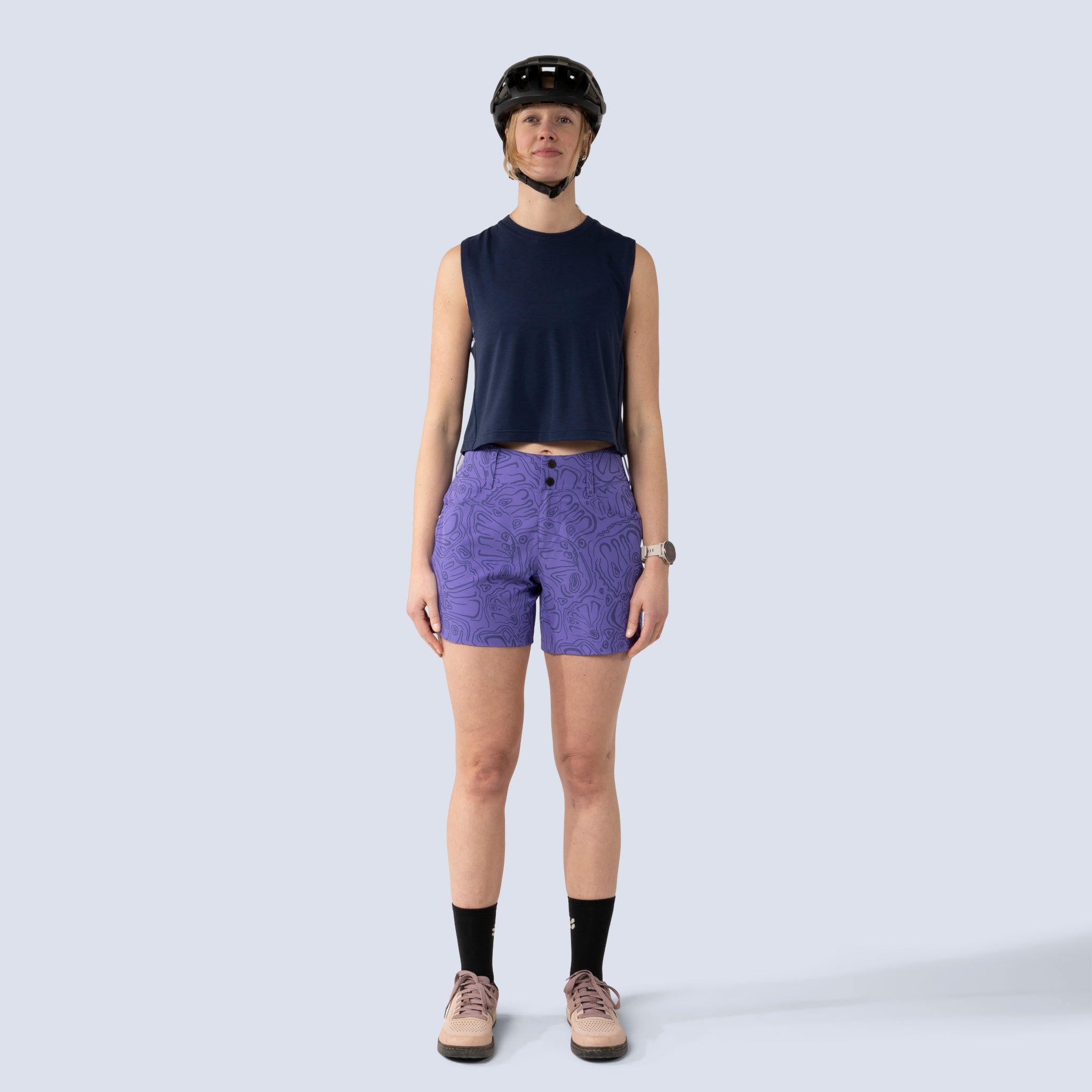 [Midnight] Person wearing a black helmet and midnight keller crop tank, front full body view