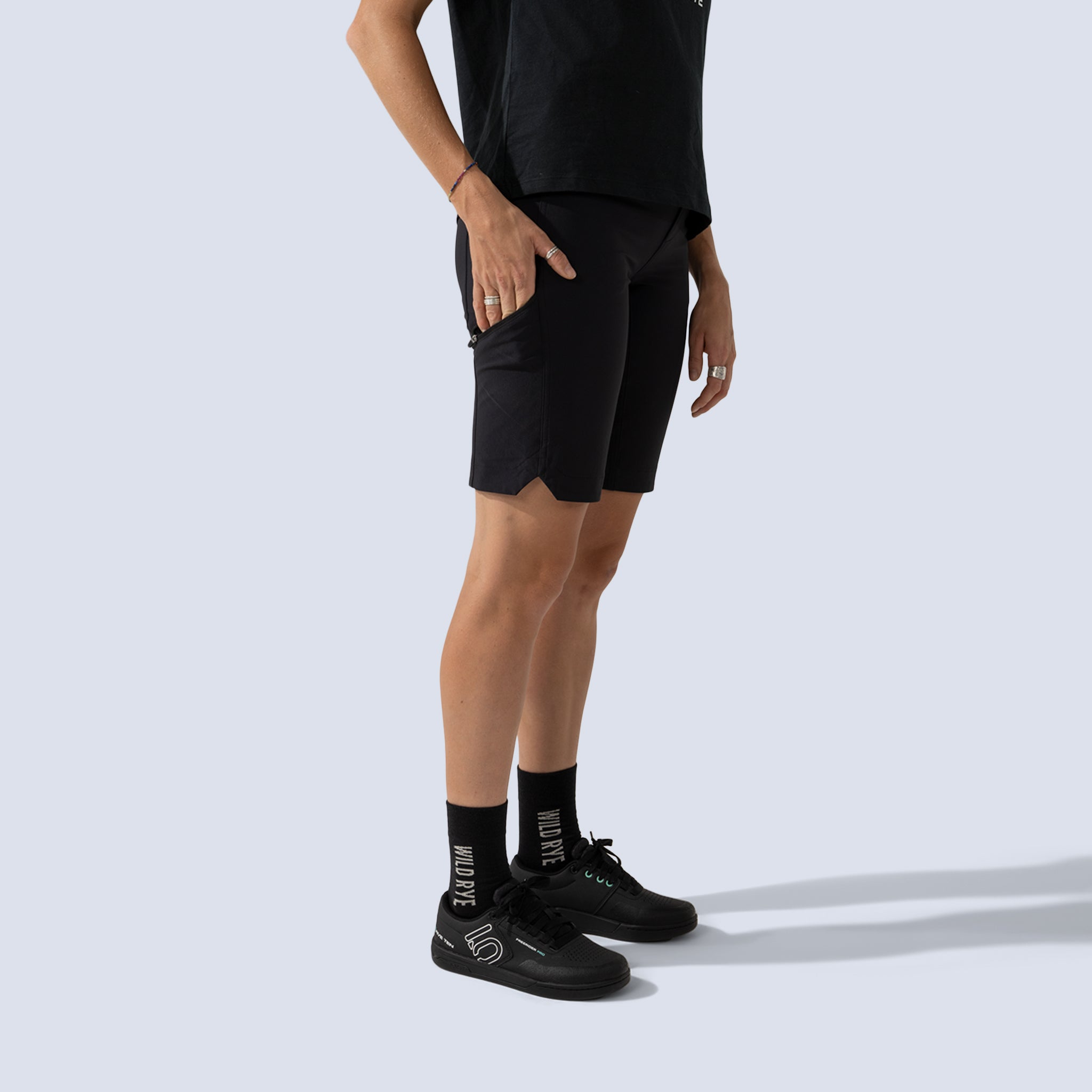[Black] Freel 12" bike shorts in black, on model side crop view