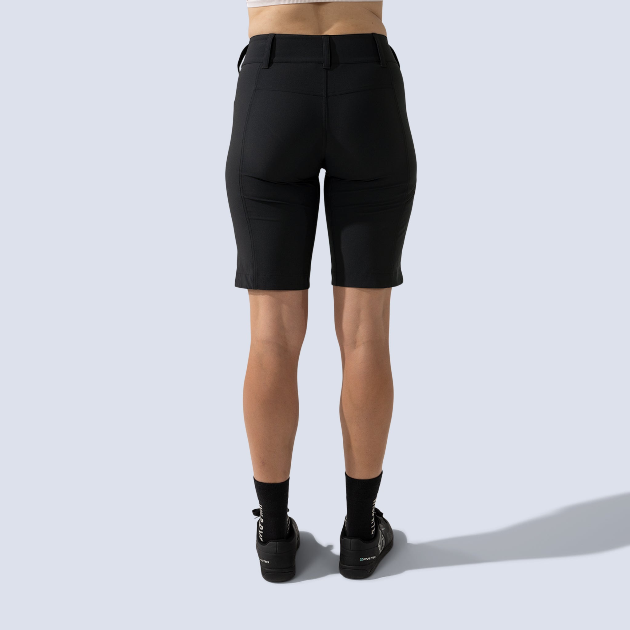[Black] Freel 12" bike shorts in black, on model back crop view