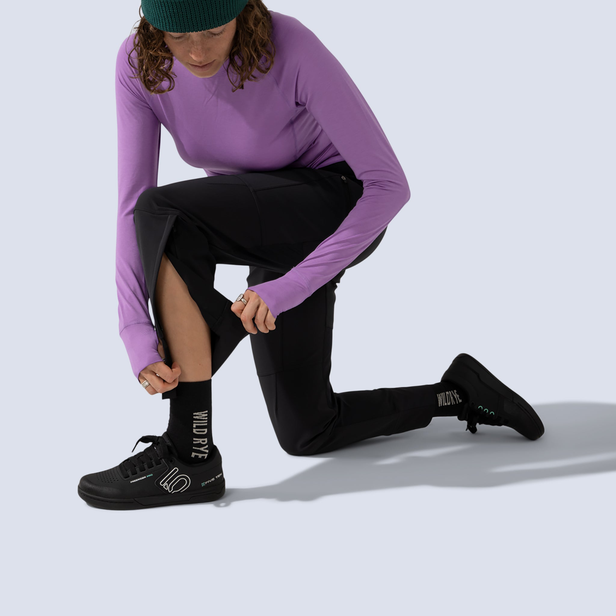 Black softshell freyah pant, on model ankle zip detail