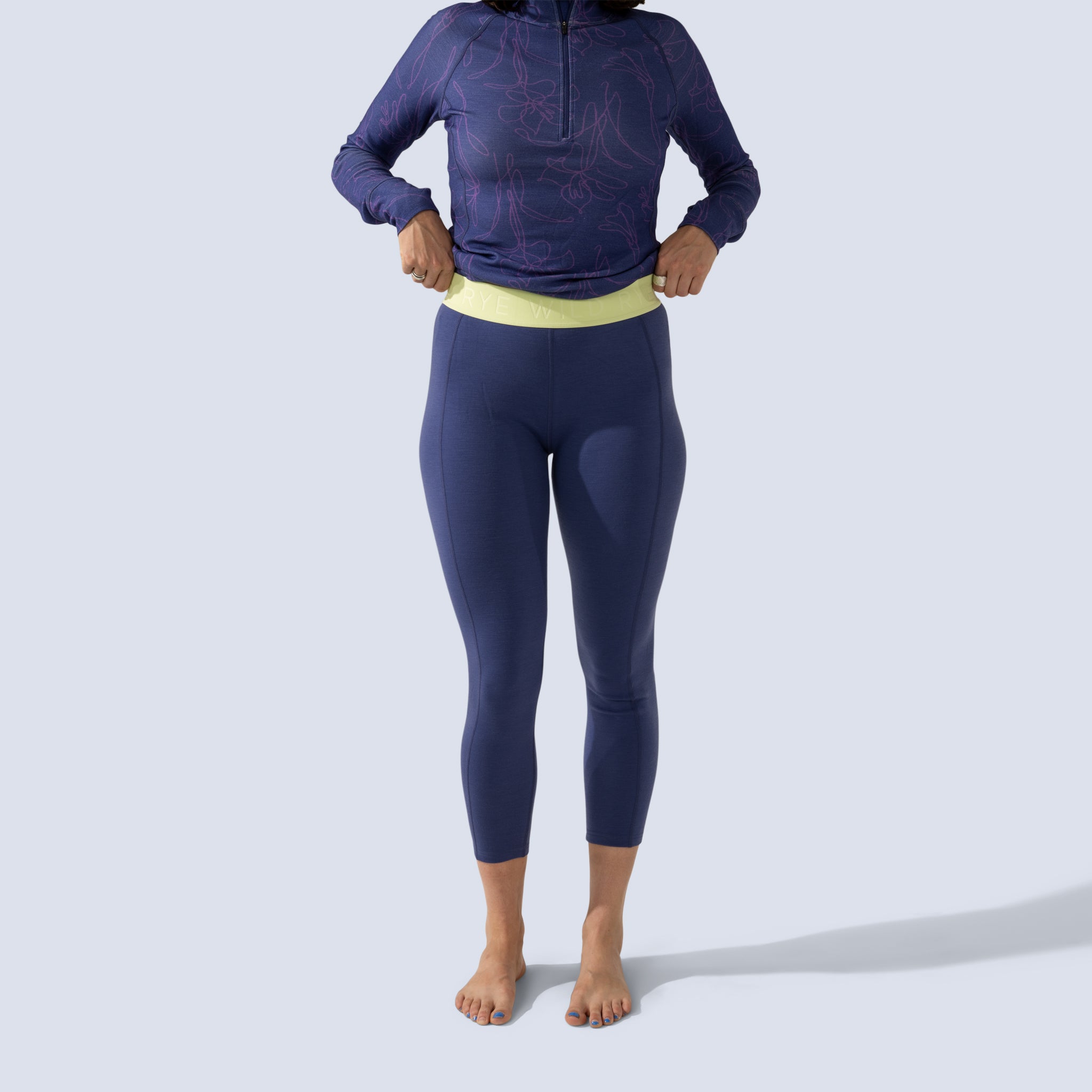 [Storm] Storm blue baselayer legging with green waistband, front crop view