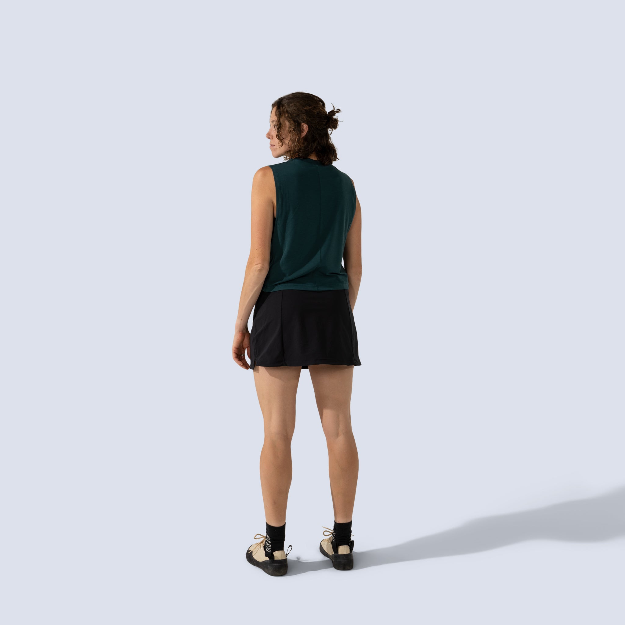 [Black] Parker Skort Black back full body, paired with green tank top