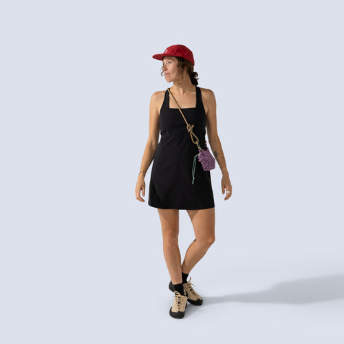 [Black] Woman wearing black Parker dress, and red cap 