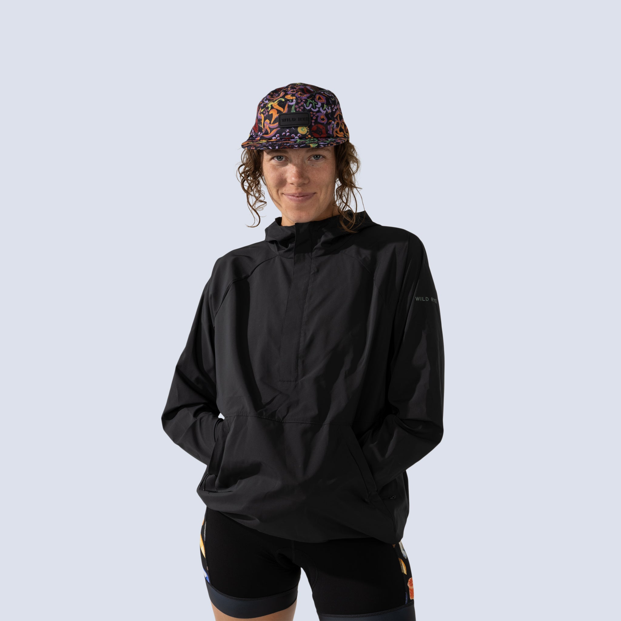 [Black] Black Alden Anorak Windbreaker front crop view with hands in pockets 