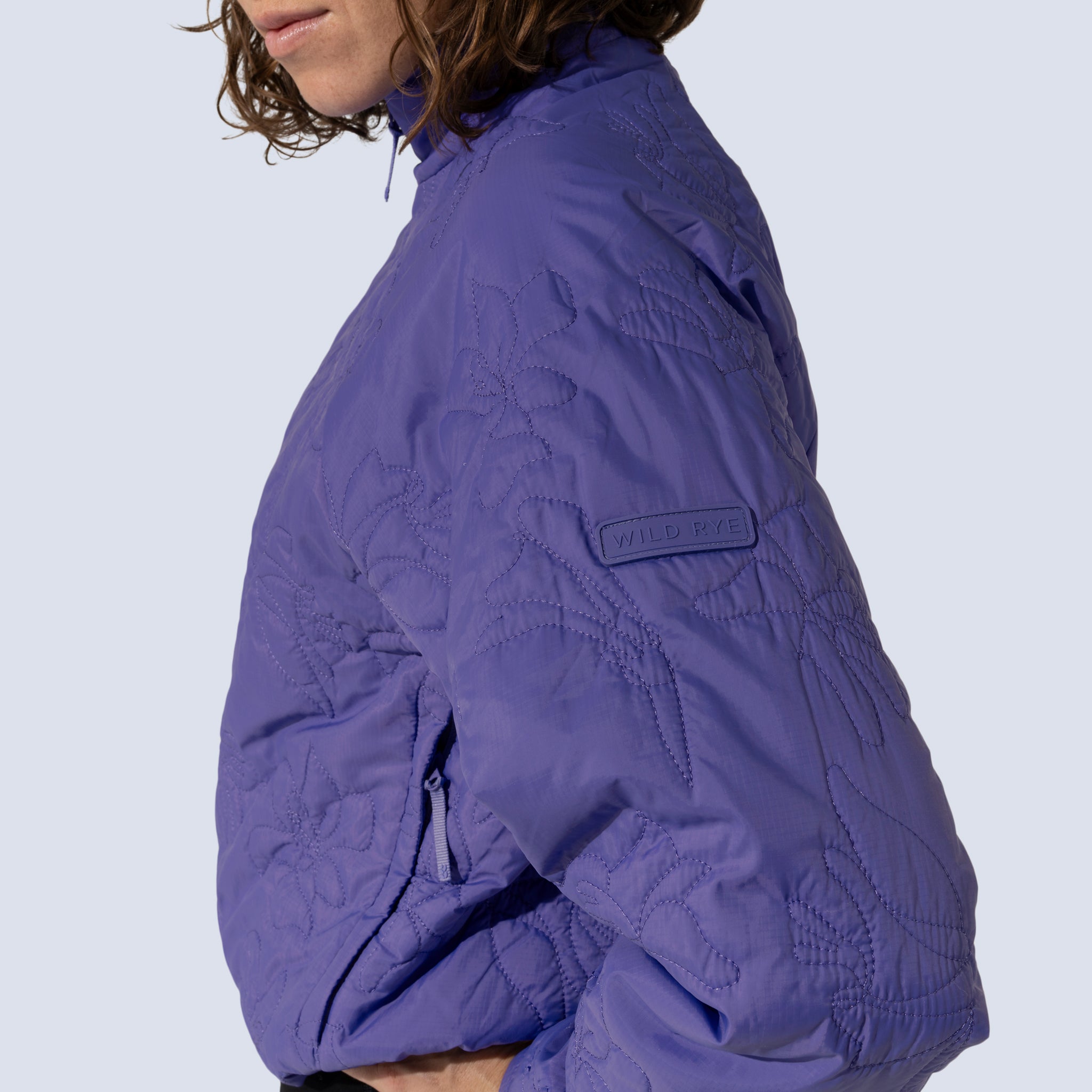 [Iris] Payette pullover in Iris, silicone logo patch detail on arm 