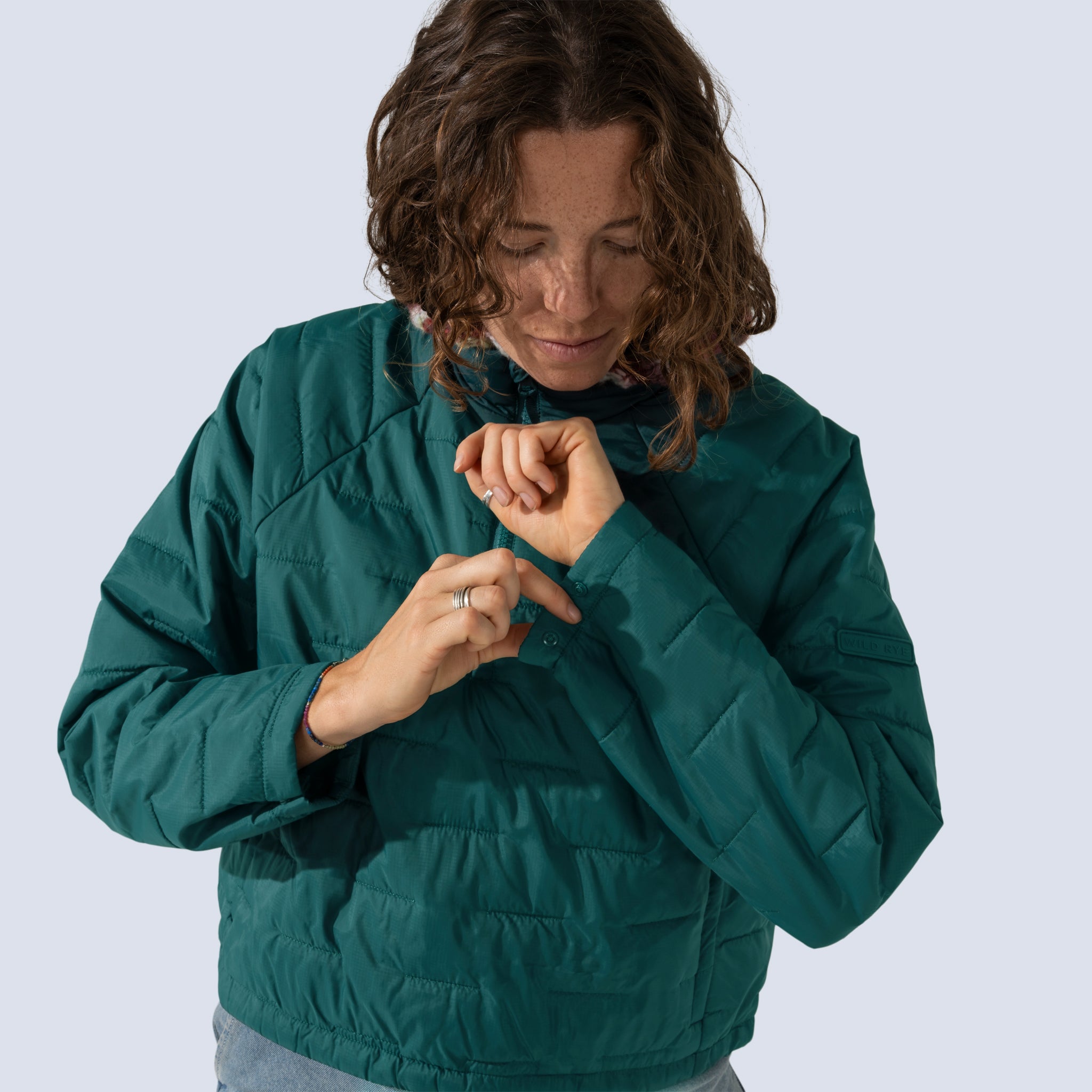 [Shaded Spruce] Payette insulated pullover in shaded spruce, model showing cuff snap feature