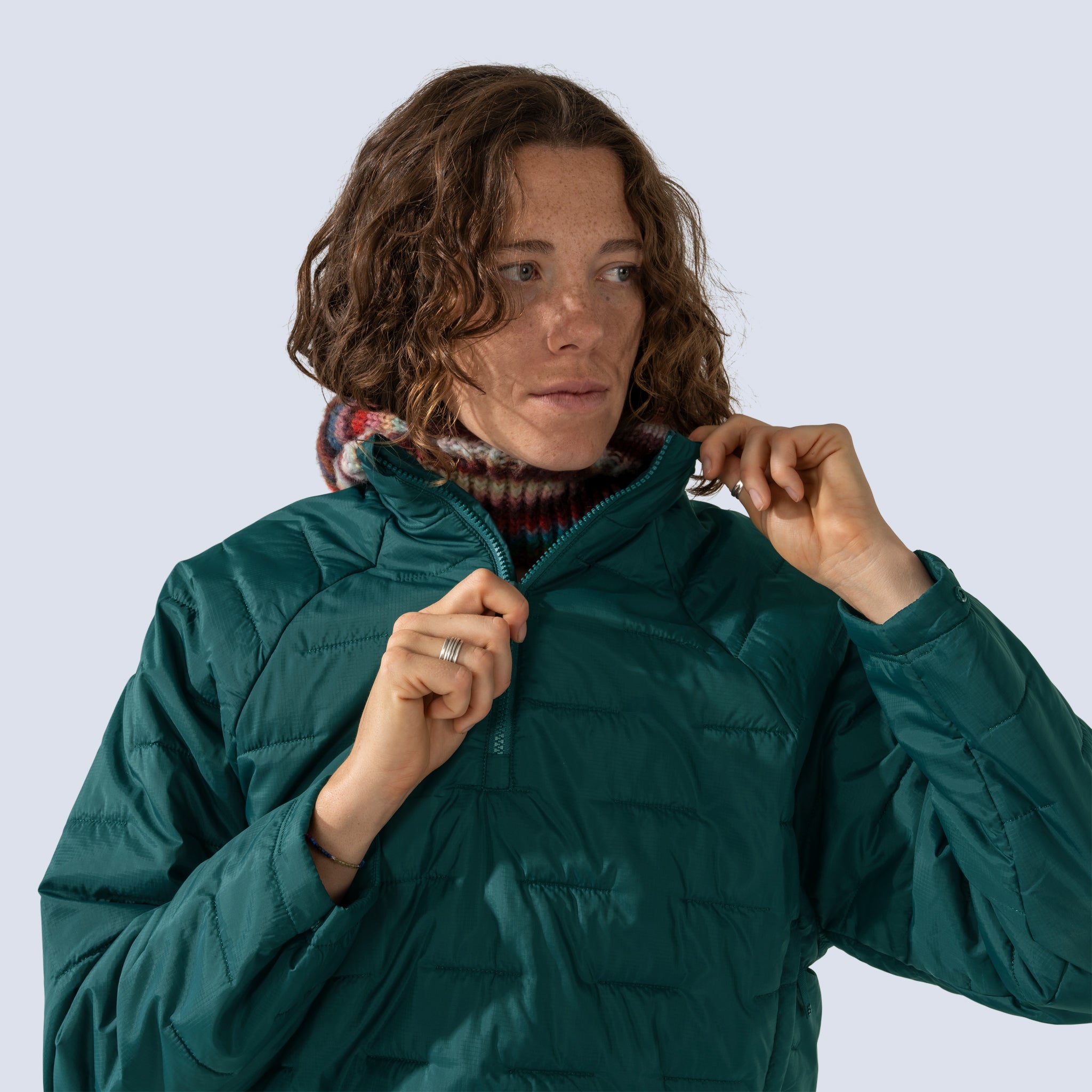 [Shaded Spruce] Payette insulated pullover in shaded spruce, model zipping up jacket