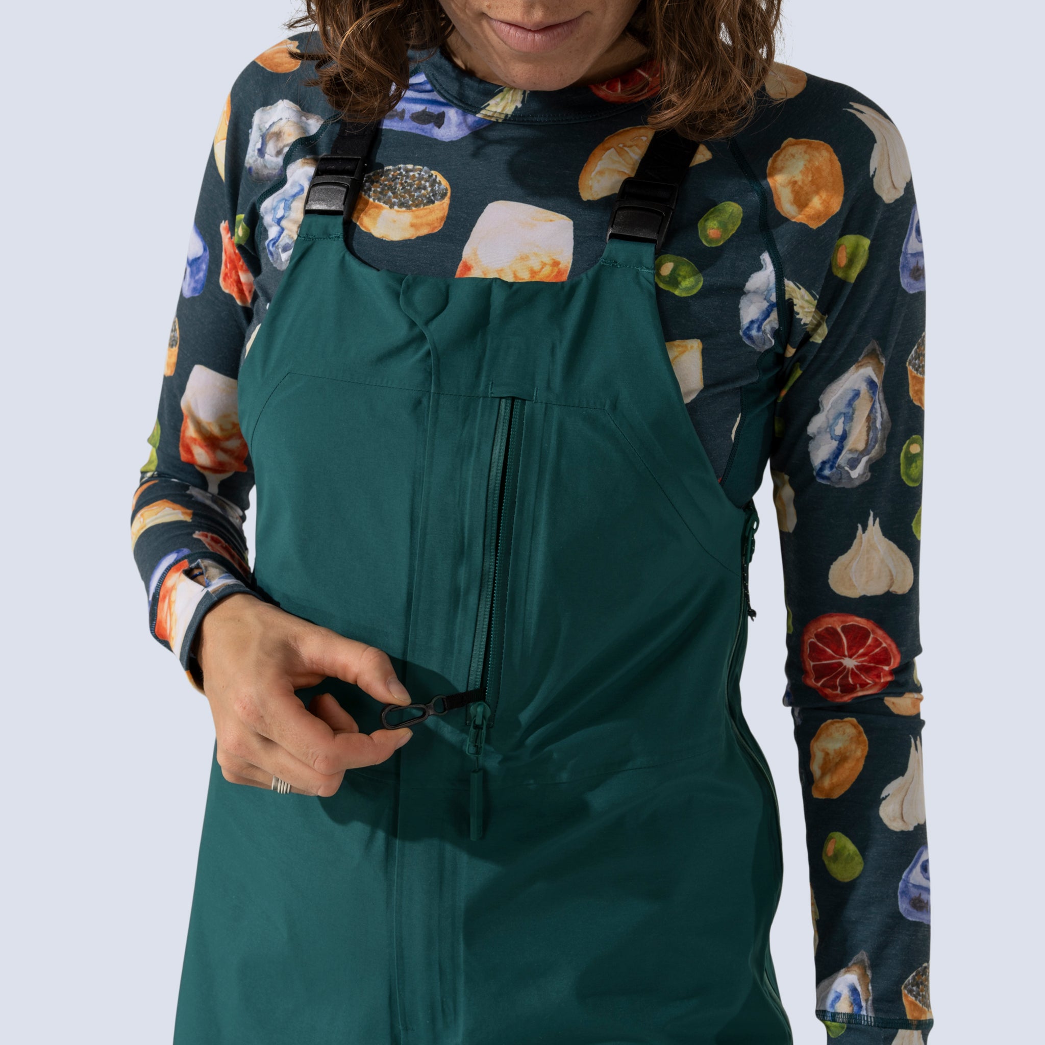 [Shaded Spruce] Heyburn 3l bibs in shaded spruce, chest pocket security clip detail