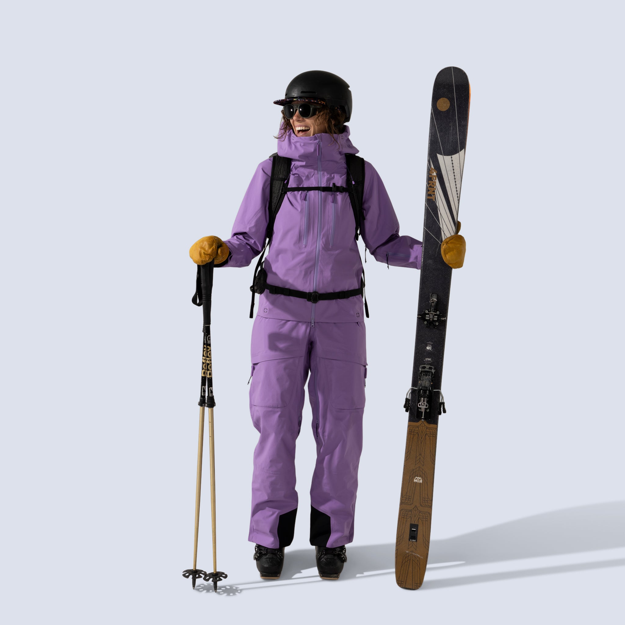 [Amethyst] Heyburn 3L Jacket in amethyst, model holding skis and poles